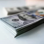 Долар та фондовий ринок відреагував на зниження кредитного рейтингу США